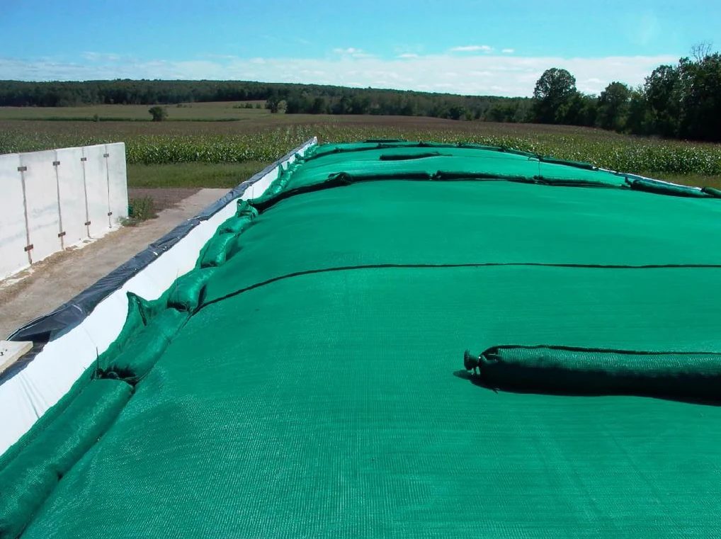 Green protective silage cover with gravel bags